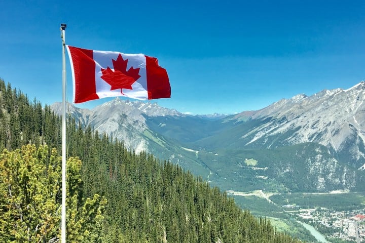 canada-flag-with-mountain-range-view-756790