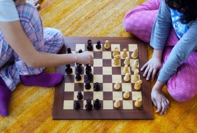 Two Girls Playing Chess; Tarifa, Cadiz, Andalusia, Spain