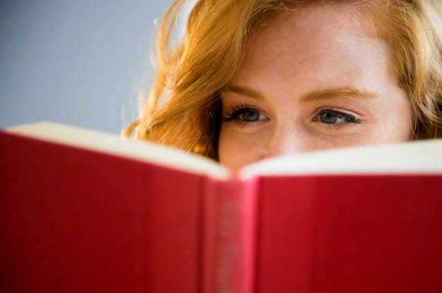 Young woman reading book